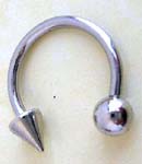 Lip ring wholesale supplier. Circular surgical steel navel barbell belly, lip or eyebrow ring with spike of one end and ball on other