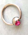 Nose or nipple body art wholesale shopping. Pink rhinestone inlaid in ball of body ring for lip, eyebrow, nipple, or nose