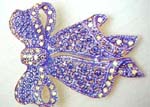 Crafted wholesale womens accessory brooch jewelry. Gift bow designed fashion pin embedded with purple and clear rhinestones