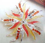 Womens wholesale jewelry catalog shopping. Fashion floral brooch with silver, orange, yellow petals and amber colored cz gemstones