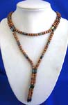 Womens accessory factory distributes Magnetic hematite wrap with wooden beads between cylindrical hematite stones.