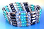 Womens jewelry boutique wholesale store. Hematite wrap with light blue imitation pearls, silver flower beads, and clear crystal beads. Can be worn as necklace or bracelet