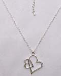 Wholesale womens fashion jewelry store. Heart shaped, silver plated pendant inlaid with cz stones 