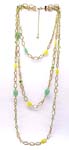 Discount vintage jewelry supply company distributes gold plated chain necklace with yellow and green translucent beads