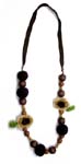 Jewelry factory distributes wholesale necklaces. Brown and tan colored fabric necklace with flower motif designs and wooden beads