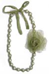 Unique jewelry design wholesale store distributes Green imitation pearl necklace with matching colored taffeta flower and lace up bow