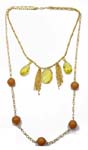 Precious stone jewelry manufacturer supplies gold plated chain necklace with yellow crystals , gold tassels, and brown, solid beads