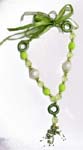 Womens wholesale fashion accessory shopping. Green and white fashion necklace with imitation pearls, crystals and beads.