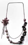 Online handcrafted jewelry source distrbutors. Iridescent black ball bead necklace with maroon flower and silver plated chain 